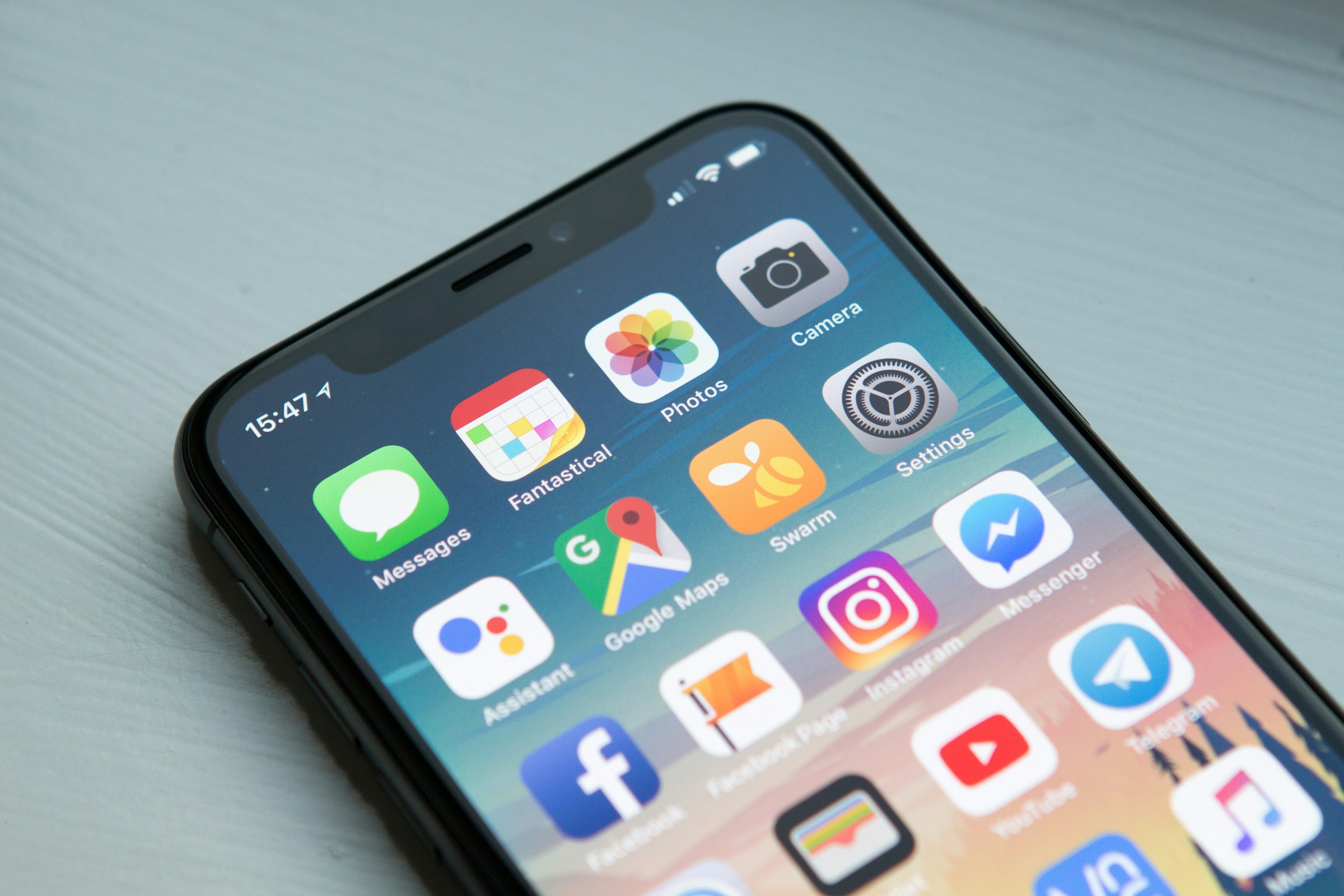 Mobile CRM application running on smartphone with sales data